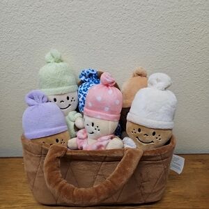 Charming Basket of Plush Baby Dolls